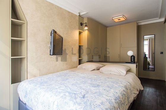 Bright bedroom equipped with tv