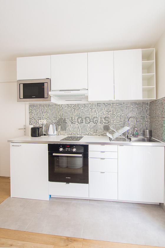 Magnifique cuisineouverte sur le séjour avec du carrelage au sol