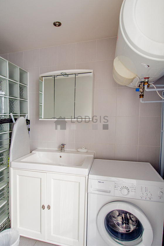 Bathroom equipped with washing machine, bath towels