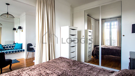Very bright bedroom equipped with wardrobe, cupboard, bedside table