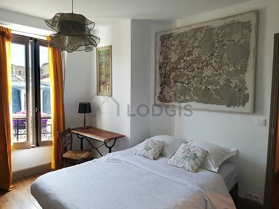 Bedroom with wooden floor