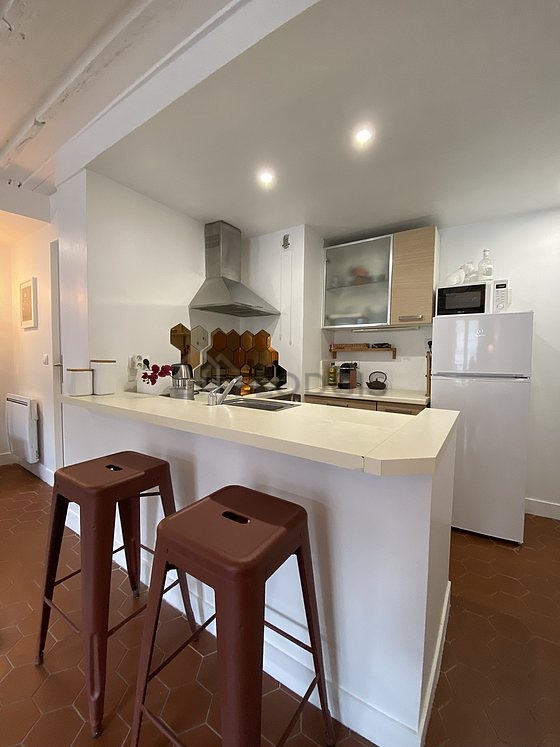 Kitchen where you can have dinner for 2 person(s) equipped with washing machine, refrigerator, extractor hood, crockery
