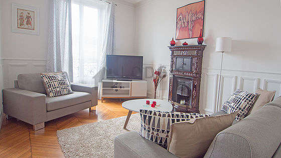 Very quiet living room furnished with tv, 1 armchair(s)