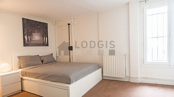 Bedroom with wooden floor