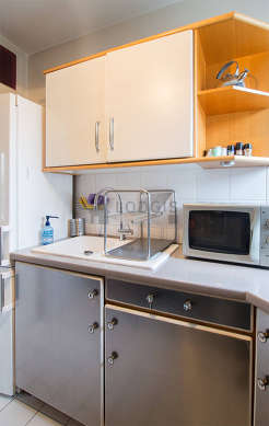 Kitchen where you can have dinner for 2 person(s) equipped with washing machine, refrigerator, crockery