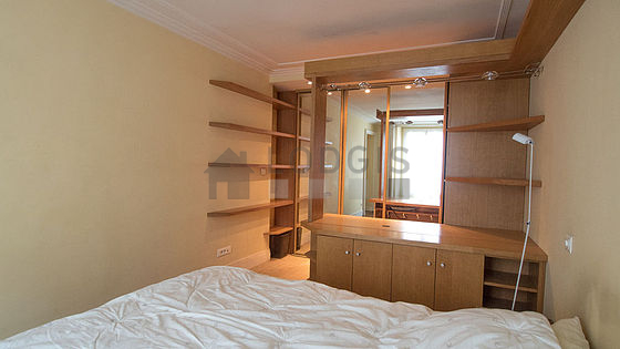 Bright bedroom equipped with wardrobe, cupboard