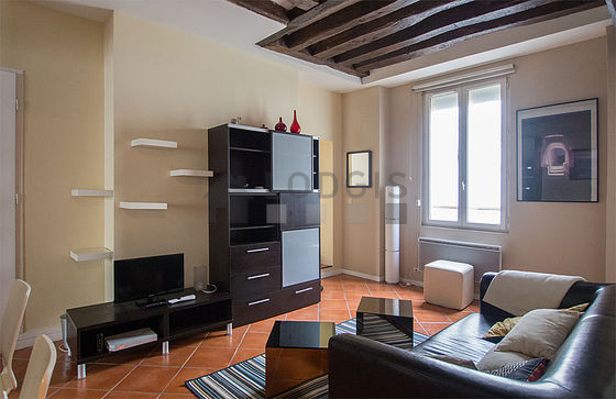 Very quiet living room furnished with tv, closet, 4 chair(s)