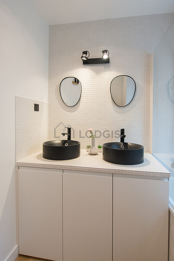 Bathroom equipped with washing machine, dryer, bath towels