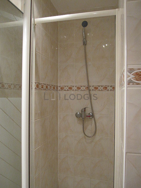 Bathroom equipped with washing machine, cupboard