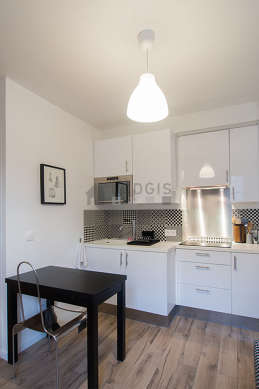 Kitchen where you can have dinner for 2 person(s) equipped with hob, refrigerator, freezer, extractor hood