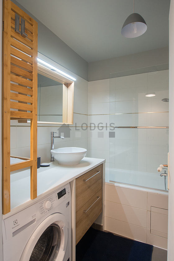 Bathroom equipped with washing machine, bath towels