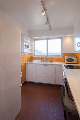 Kitchen where you can have dinner for 2 person(s) equipped with hob, refrigerator, crockery, stool