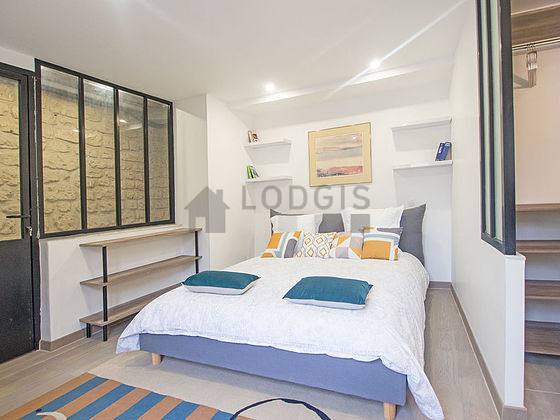 Bedroom with wooden floor