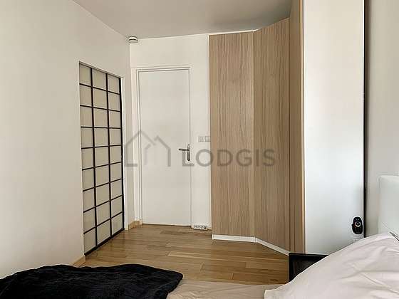 Bright bedroom equipped with wardrobe, cupboard
