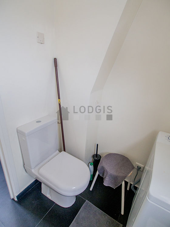 Bathroom equipped with washing machine, bath towels