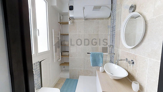 Pleasant and bright bathroom with double-glazed windows and with tile floor