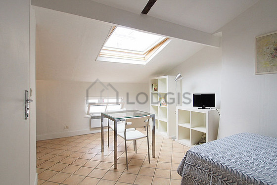 Quiet living room furnished with 1 bed(s) of 120cm, tv, wardrobe, 2 chair(s)
