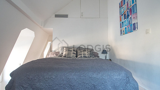 Very bright bedroom equipped with air conditioning, closet