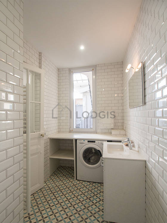 Pleasant and bright bathroom with tile floor