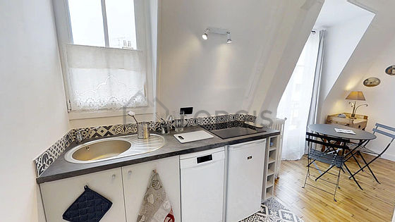 Kitchen equipped with washing machine, refrigerator, freezer, crockery