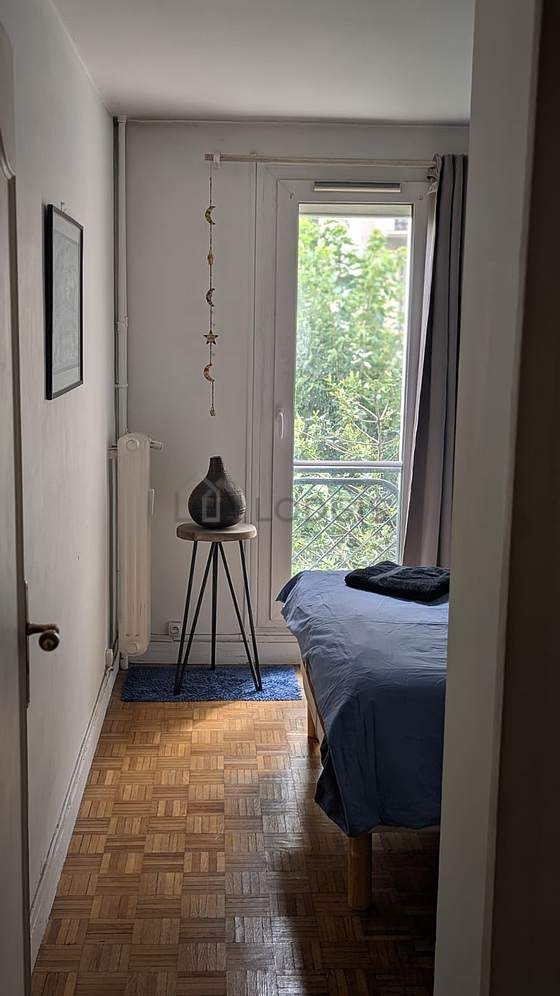 Bright bedroom equipped with cupboard, 1 chair(s), stool