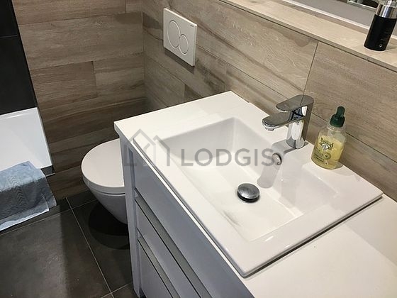 Bathroom equipped with washing machine, bath towels