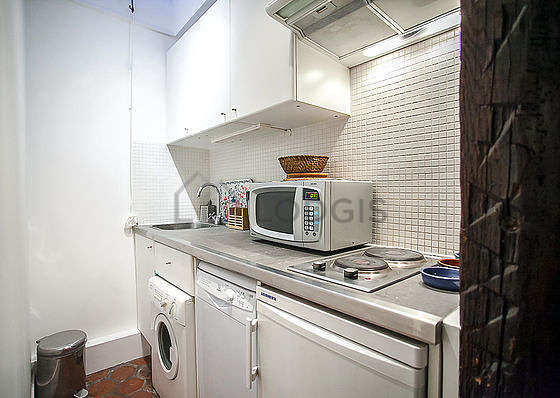 Kitchen equipped with washing machine, refrigerator, freezer