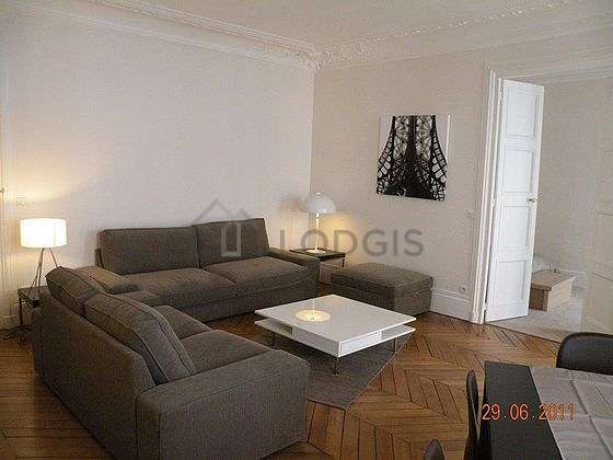 Very quiet living room furnished with tv, 1 armchair(s), 1 chair(s)