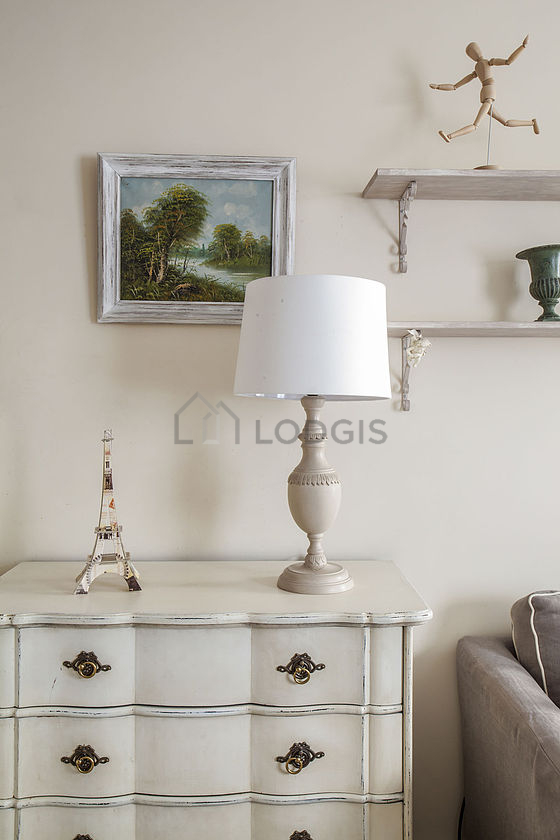 Quiet living room furnished with 1 bed(s) of 140cm, tv, hi-fi stereo, 1 armchair(s)