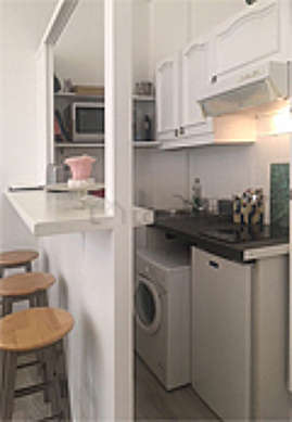 Kitchen where you can have dinner for 3 person(s) equipped with washing machine, refrigerator, extractor hood, crockery