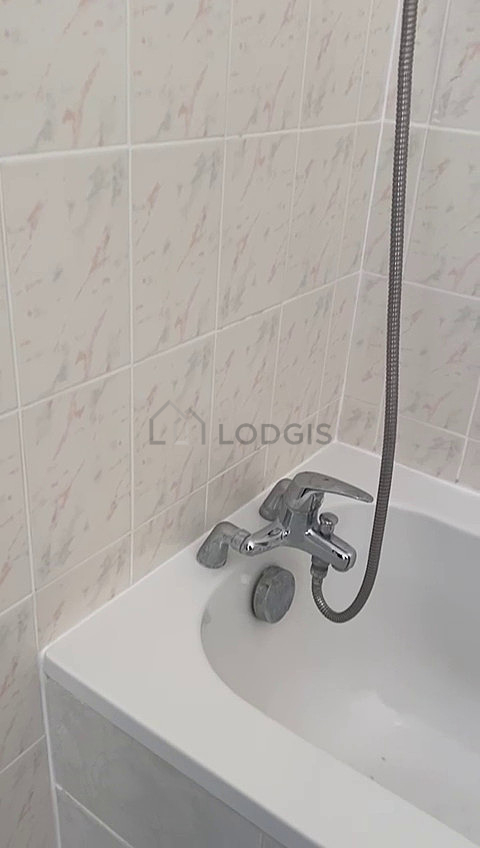 Bathroom equipped with washing machine, bath towels