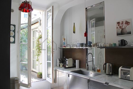 Kitchen where you can have dinner for 2 person(s) equipped with washing machine, refrigerator, crockery, stool