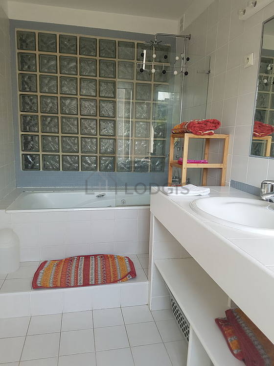 Pleasant and bright bathroom with tile floor