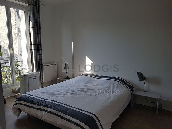 Chambre de 16m² avec du parquet au sol