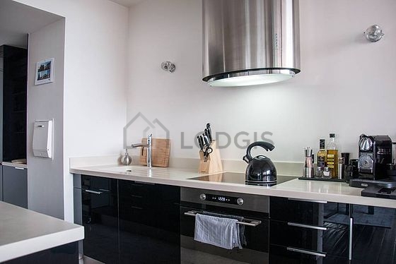 Kitchen equipped with washing machine, refrigerator, freezer, crockery