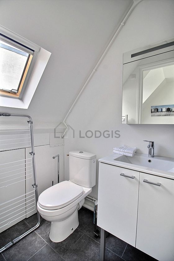 Pleasant and bright bathroom with tile floor