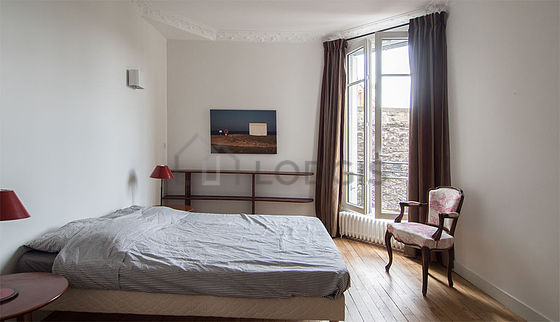 Bedroom with wooden floor