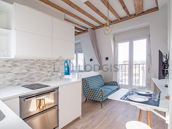 Kitchen equipped with dishwasher, refrigerator, crockery