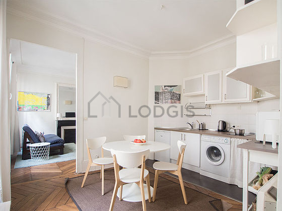 Kitchen where you can have dinner for 4 person(s) equipped with washing machine, refrigerator, crockery