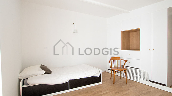 Bedroom with wooden floor