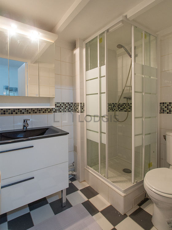 Pleasant and bright bathroom with tile floor
