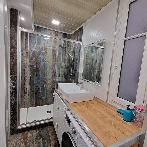 Pleasant bathroom with double-glazed windows and with tile floor