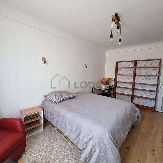 Bedroom with wooden floor