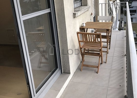 Living room with double-glazed windows and balcony