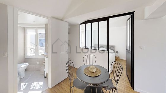 Bedroom of 9m² with wooden floor