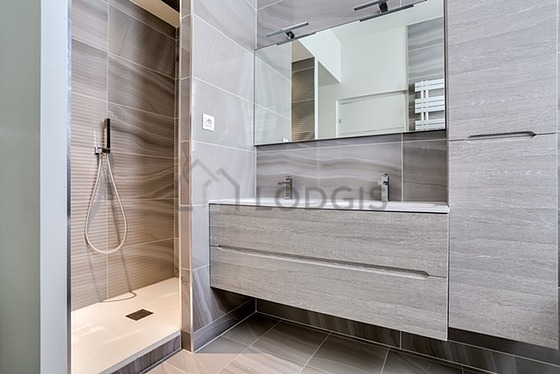 Pleasant and bright bathroom with double-glazed windows and with tile floor