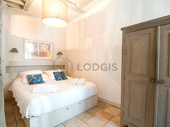 Bedroom with tile floor