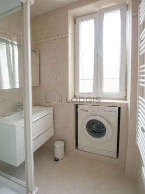 Bathroom equipped with washing machine, bath towels