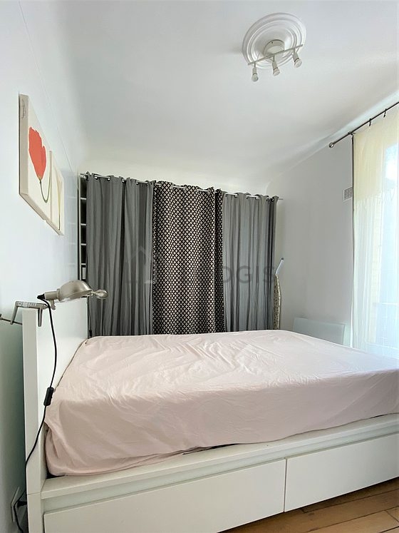 Bedroom with wooden floor