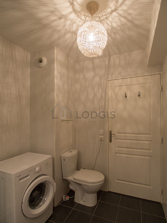 Bathroom equipped with washing machine, bath towels